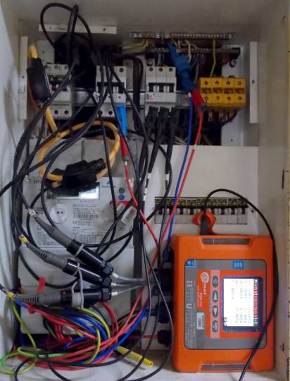 Figure 1. Sonel PQM-711 power quality monitor shown deployed and measuring